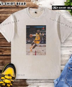 LeBron James in a Los Angeles Lakers No. 23 washed t-shirt, showcasing his superstar pose on the basketball court.