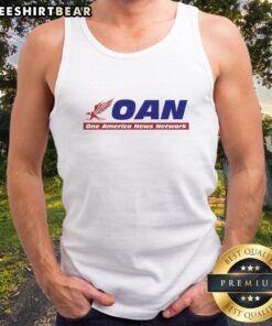Mike Gundy wearing a tank top featuring OAN logo at an event, showcasing his support for One America News Network.