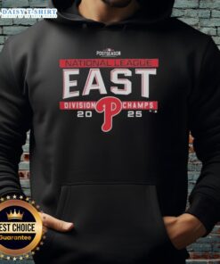 Alt Text: Philadelphia Phillies 2025 NL East Division Title postseason hoodie displayed in locker room, showcasing team pride.