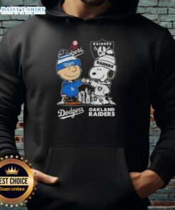 Hot Snoopy and Charlie Brown hoodie featuring Los Angeles Dodgers and Las Vegas Raiders skyline design.