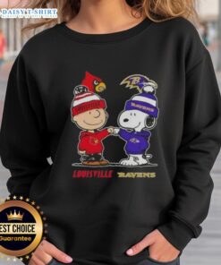 Hot Snoopy and Charlie Brown sweatshirt featuring Louisville Cardinals and Baltimore Ravens logos, perfect for sports fans.