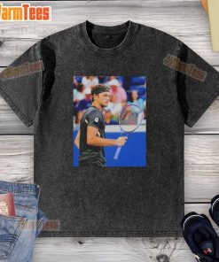 Taylor Fritz wearing a stylish washed t-shirt during the 2025 US Open tennis tournament.
