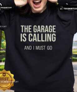 Hot-The-Garage-Is-Calling-And-I-Must-Go sweatshirt featuring a bold graphic design, perfect for automotive enthusiasts.