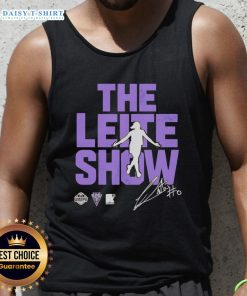 Carla Leite wearing a stylish Golden State Valkyries tank top on 'Hot The Leite Show' set, showcasing trendy sports fashion.