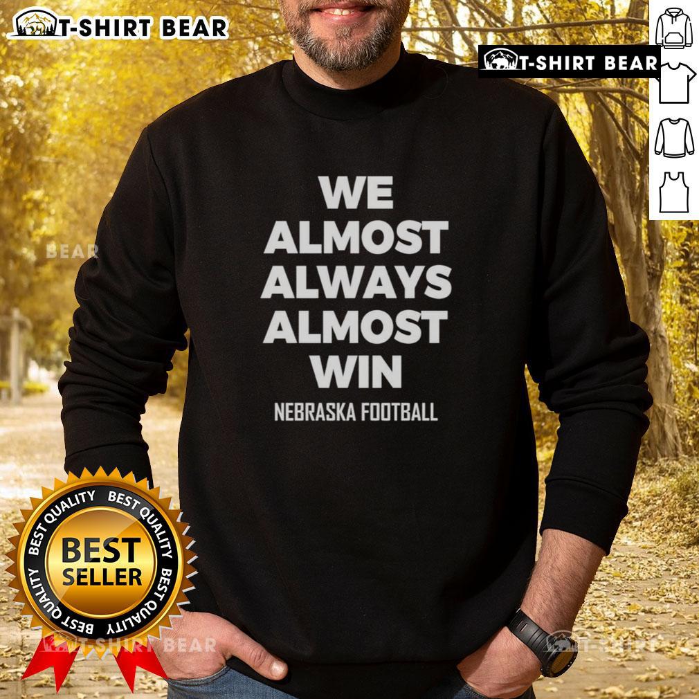 Hot We Almost Always Almost Win Nebraska Football Sweatshirt Hot We Almost Always Almost Win Nebraska Football Sweatshirt in red, showcasing team spirit and stylish design.