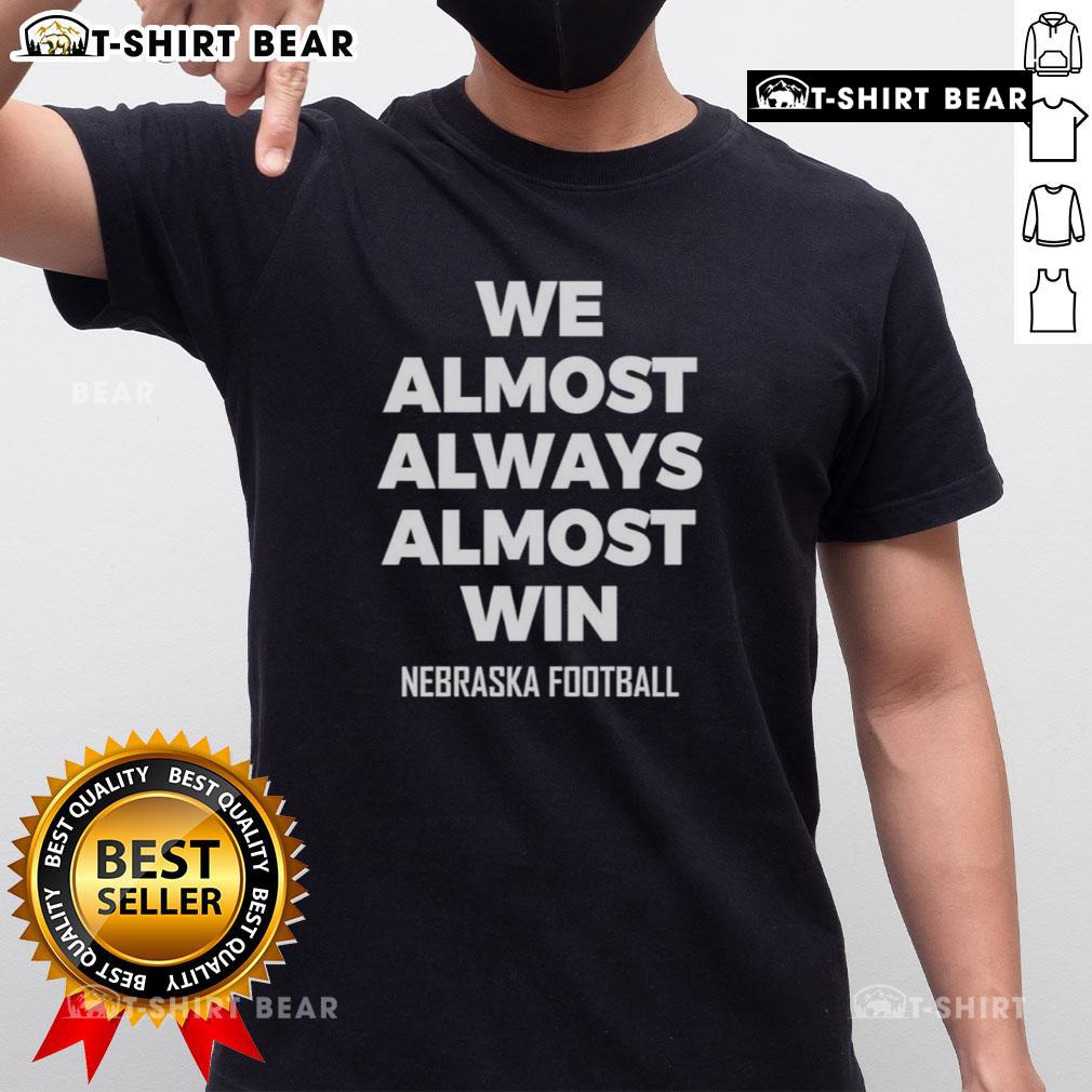 Hot We Almost Always Almost Win Nebraska Football T Shirt Alt Text: Hot We Almost Always Almost Win Nebraska Football T-Shirt featuring bold graphics and vibrant colors for fans.
