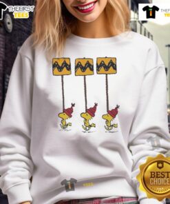 Funny Charlie Brown sweatshirt featuring yellow and black Woodstock peanuts design for Christmas celebrations.