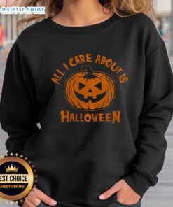 Cozy Halloween pumpkin sweatshirt with 'All I Care About Is Halloween' text, perfect for fall festivities.