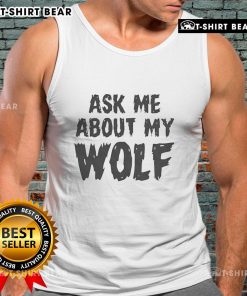 Person wearing a 'Nice Ask Me About My Wolf' tank top, showcasing a stylish wolf graphic at a vibrant outdoor setting.