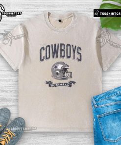 Alt Text: Distressed vintage washed t-shirt featuring a Dallas Cowboys football helmet design for fans.