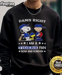 Cozy sweatshirt featuring Snoopy and Charlie Brown, proudly declaring 'Tigers Fan Now and Forever.' Perfect for any fan!