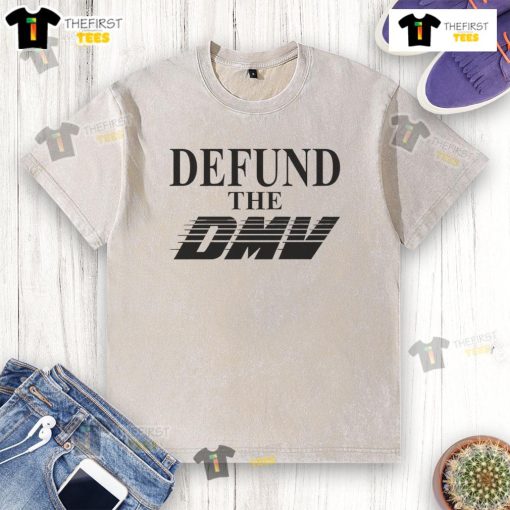 Stylish 'Defund The DMV' washed t-shirt in a casual setting, perfect for expressing your unique style and beliefs.