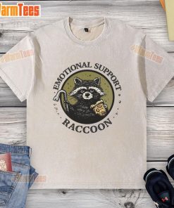 Adorable emotional support raccoon on a washed t-shirt, showcasing a cute design perfect for animal lovers.