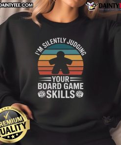 Cozy adults wearing 'Nice Game Night' sweatshirt while enjoying board games during a fun game night.