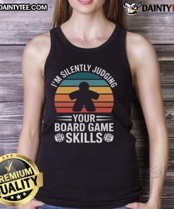 Adults enjoying game night in stylish tank tops, featuring a variety of board games on a cozy table setting.