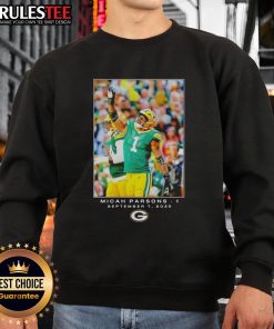 Micah Parsons wearing a Nice Green Bay sweatshirt featuring Flash design during Week 1 of the NFL season.
