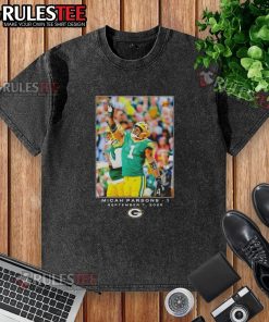 Micah Parsons wearing a Nice Green Bay Week 1 washed t-shirt, showcasing vibrant colors and casual style.