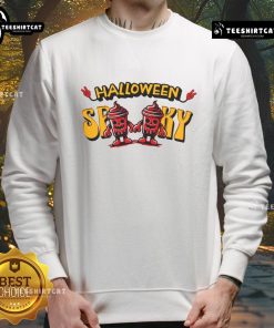 Spooky skeleton drink cup design on a cozy Halloween sweatshirt for festive fall celebrations.
