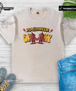 Alt Text: Spooky skeleton drink cup design on a washed T-shirt, perfect for Halloween festivities and themed apparel.