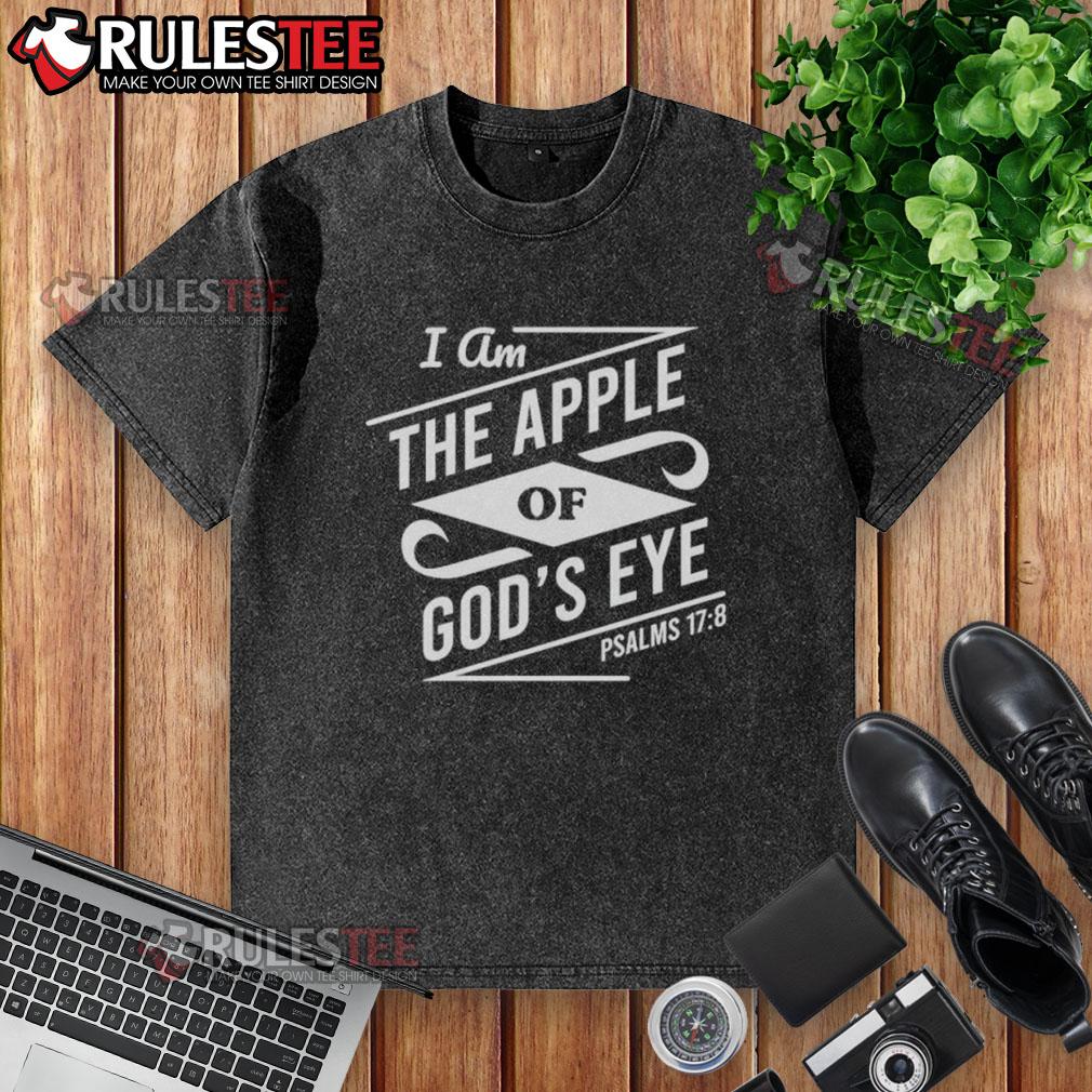 Nice I Am The Apple Of God'S Eye Washed T Shirt Nice I Am The Apple Of Gods Eye washed t-shirt in vibrant colors displayed on a wooden background, showcasing unique design.