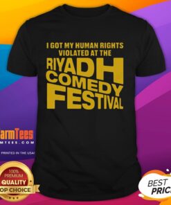 T-shirt featuring 'Nice I Got My Human Rights Violated At The Riyadh Comedy Festival' slogan in bold print.
