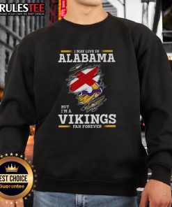 Cozy sweatshirt featuring 'Nice, I May Live In Alabama But I'm A Minnesota Vikings Fan Forever' design, perfect for fans.