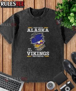 Nice I May Live In Alaska But I'm A Minnesota Vikings Fan Forever washed t-shirt with vibrant team colors and logo.