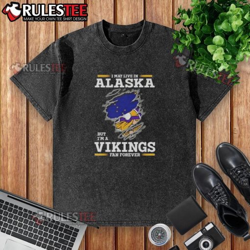 Nice I May Live In Alaska But I'm A Minnesota Vikings Fan Forever washed t-shirt with vibrant team colors and logo.
