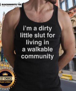 Model wearing 'Nice I'm A Dirty Little Slut' tank top in a vibrant walkable community setting, showcasing urban lifestyle.
