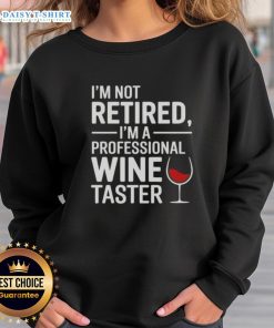 Cozy sweatshirt featuring 'Nice, I'm Not Retired, I'm A Professional Wine Taster' design, perfect for wine enthusiasts.