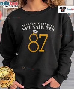 Alt Text: Cozy 'Nice It's A Love Story Baby She Said Yes 87' sweatshirt, perfect for casual outings and expressing love.