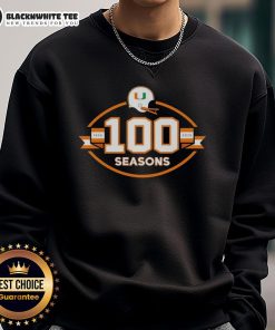 Alt Text: Cozy sweatshirt celebrating 100 seasons of Miami Hurricanes football from 1926 to 2025, perfect for fans.