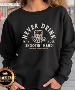 Sendero Provisions Co. sweatshirt featuring 'Nice Never Drink With Your Shootin Hand' slogan in a stylish design.