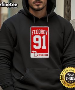 Alt Text: Sergei Fedorov Detroit Red Wings Hockey 91 banner hoodie featuring team colors and iconic logo.
