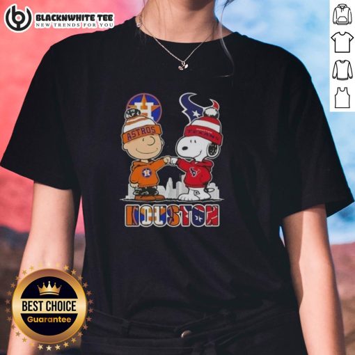Ladies tee featuring Snoopy and Charlie Brown with Houston skyline, Astros, and Texans logos for sports fans.
