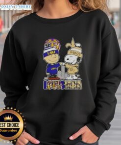 LSU Tigers x New Orleans Saints skyline sweatshirt featuring Snoopy and Charlie Brown design.