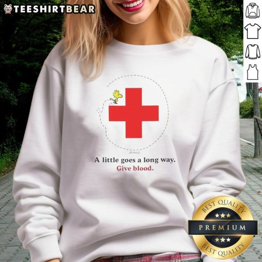 Nice Snoopy Blood Drive sweatshirt featuring a playful design, promoting the message 'A Little Goes A Long Way' for charity.