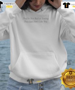 Cozy hoodie with 'They're Not Bad at Texting, They Just Don't Like You' graphic, perfect for casual wear and humor lovers.