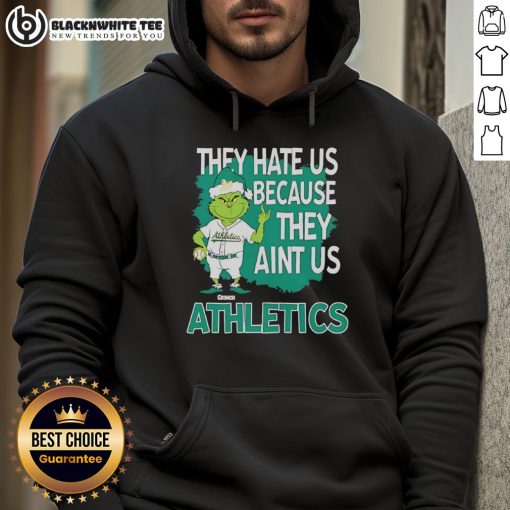 Official Athletics Grinch Christmas hoodie featuring 'They Hate Us Ain't Us' design for festive sports fans.