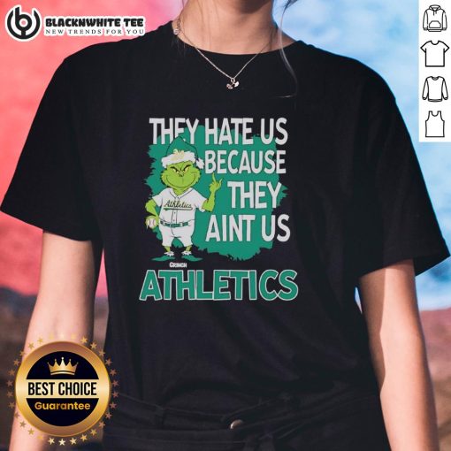 Official Athletics Grinch Christmas 'They Hate Us Ain't Us' ladies tee featuring festive design and vibrant colors.