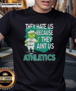Alt Text: Official Athletics Grinch Christmas They Hate Us Ain't Us T-Shirt featuring a festive Grinch design and bold text.