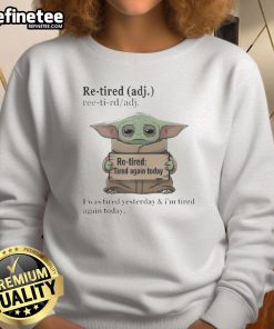 Cozy sweatshirt featuring Baby Yoda with 'Re-Tired' print, perfect for fans looking for comfortable, fun apparel.