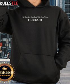 Charlie Kirk wearing a bloodied shirt with the word Freedom on his hoodie, symbolizing resilience and activism.