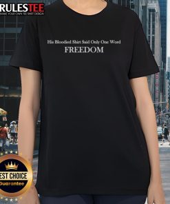 Charlie Kirk wearing a bloodied shirt with the word 'Freedom' on a ladies tee, symbolizing resilience and courage.