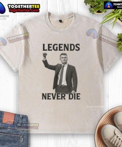 Official Charlie Kirk Legends Never Die washed t-shirt featuring bold graphic design and casual style for fans.