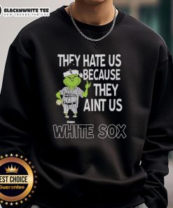 Official Chicago White Sox Grinch Christmas sweatshirt featuring 'They Hate Us Ain't Us' design for fans.