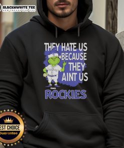 Official Colorado Rockies Grinch Christmas hoodie featuring 'They Hate Us Ain't Us' design, perfect holiday apparel.