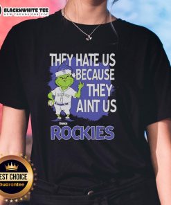 Official Colorado Rockies Grinch Christmas tee for ladies featuring 'They Hate Us Ain't Us' design in festive colors.