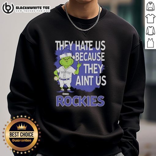 Official Colorado Rockies Grinch Christmas sweatshirt featuring 'They Hate Us Ain't Us' design, perfect for festive fans.