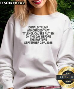 Official Donald Trump sweatshirt announcing Tylenol causes autism before the Rapture, featuring bold graphics and text.